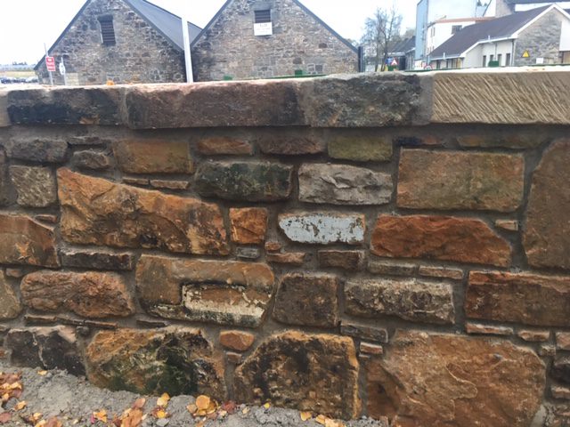 reclaimed sandstone wall renovation